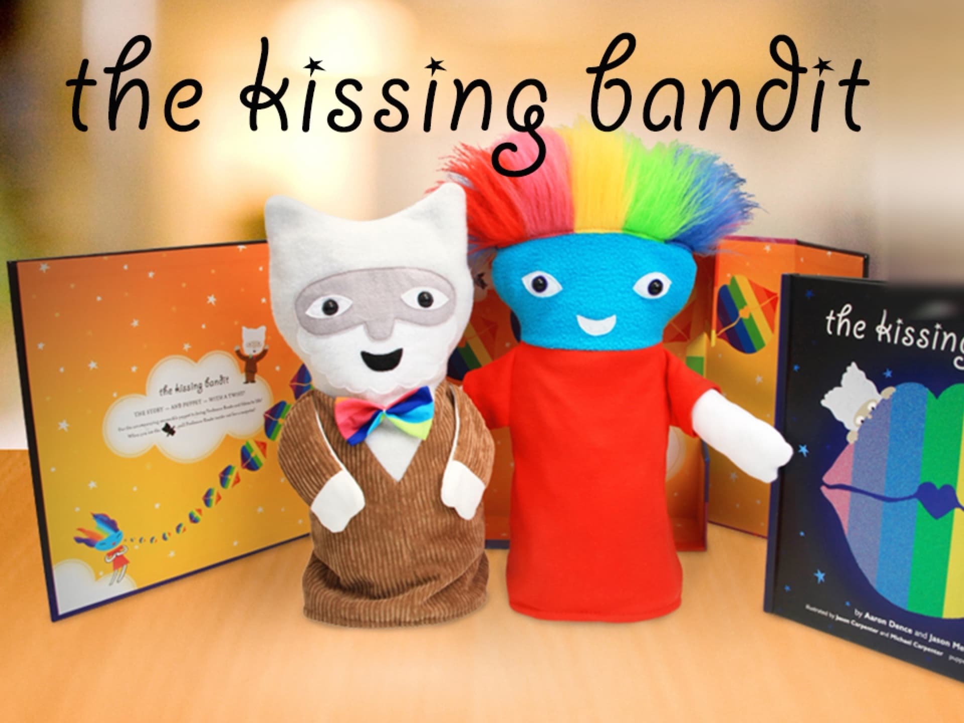 The Kissing Bandit book next to its reversible puppet, Professor Roade and Edora, with a Kickstarter Staff Pick badge