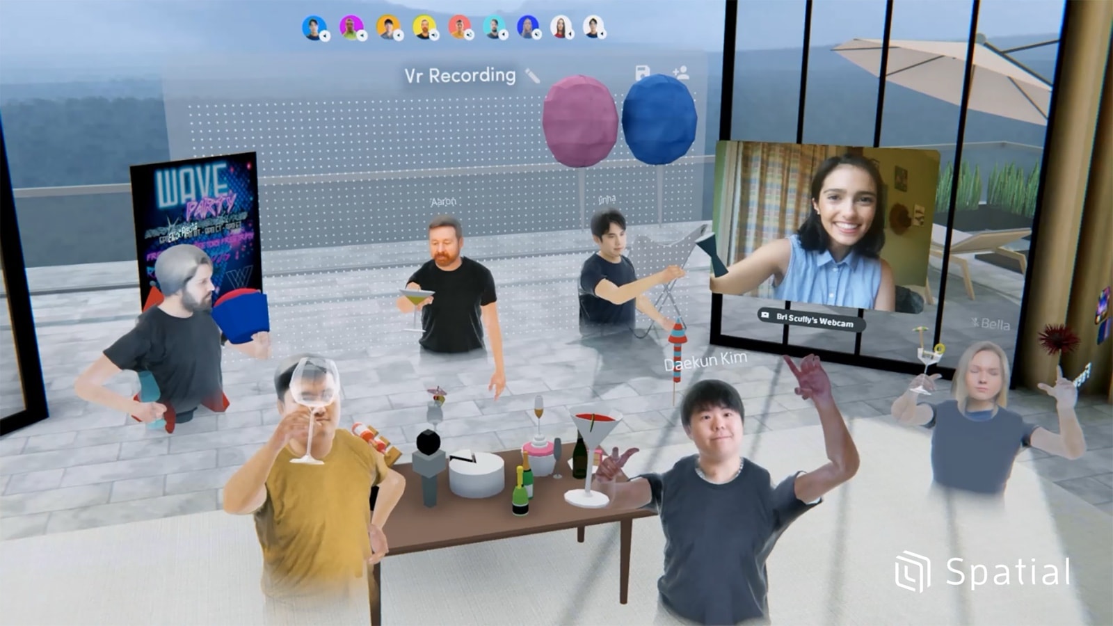 Avatars gathered around a table in a Spatial VR space, with one person joining by webcam